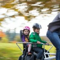 family riding e-bike